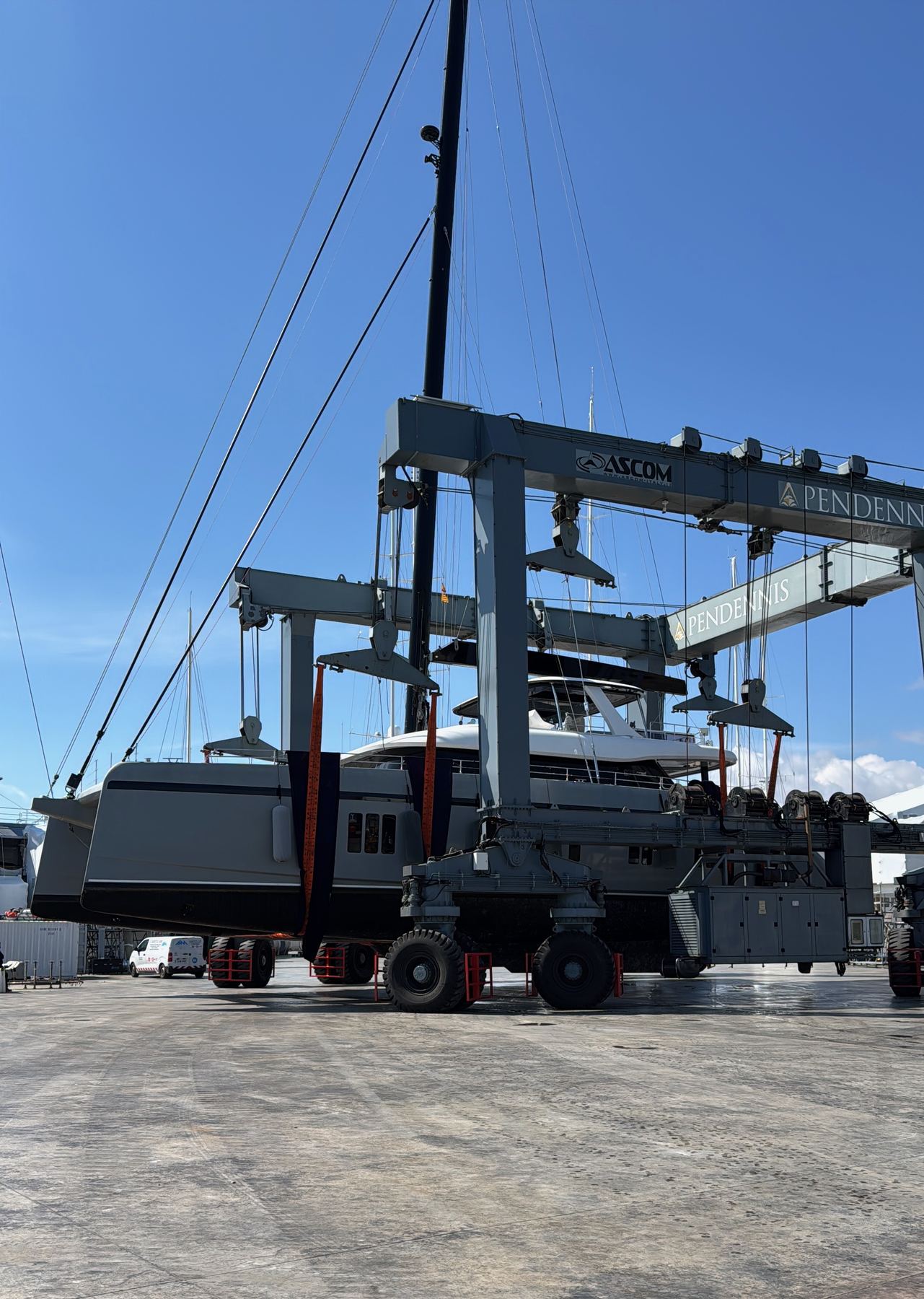 Yacht suspended in a marina travel-lift